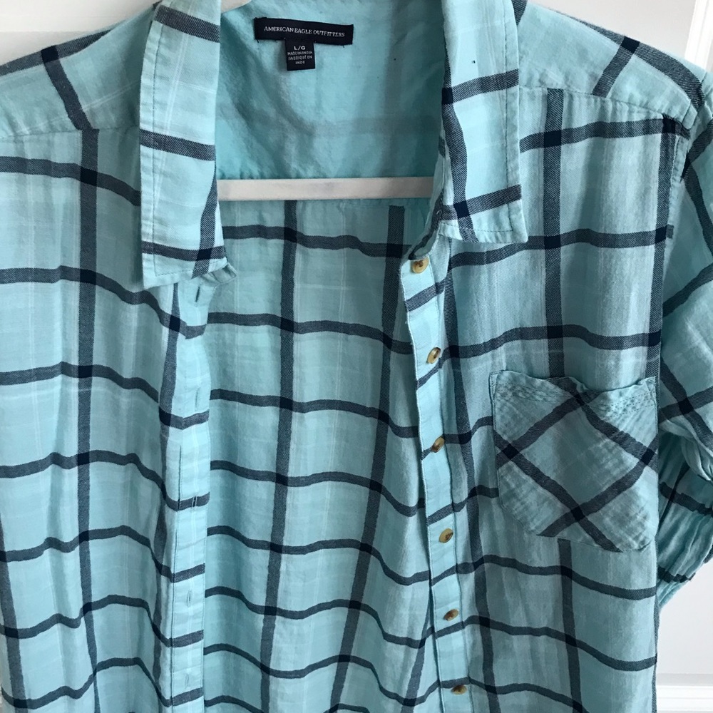 light blue colored button down with accent colors